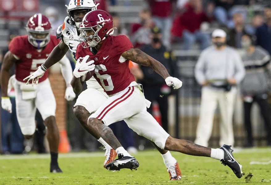 Alabama wide receiver DeVonta Smith (6) breaks free for a touchdown against Auburn during an NCAA college football game Saturday, Nov. 28, 2020, in Tuscaloosa, Ala. (Mickey Welsh/The Montgomery Advertiser via AP) **FILE**
