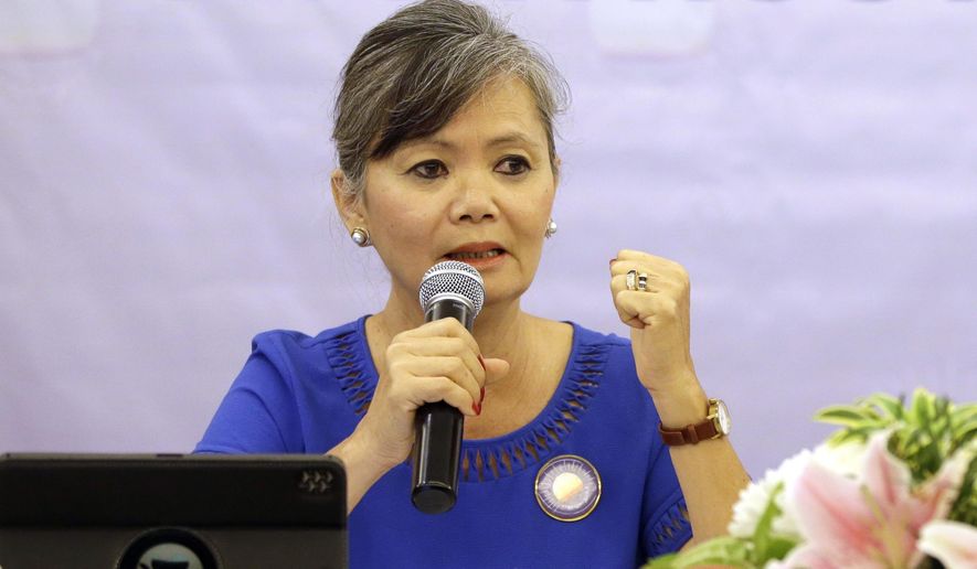 FILE - In this July 30, 2018, file photo, Vice President of the Cambodia National Rescue Party (CNRP), Mu Sochua speaks at a press conference in Jakarta, Indonesia. Senior executives of the disbanded opposition Cambodia National Rescue Party have announced their plan to return from self-imposed exile to fight criminal charges against them in court. (AP Photo/Tatan Syuflana, File)