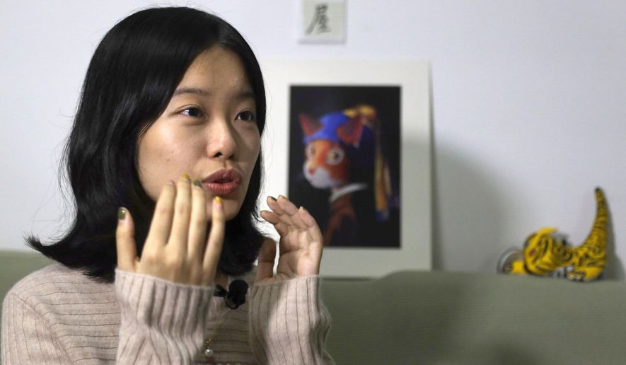 FILE - In this Jan. 16, 2019, file photo, screenwriter Zhou Xiaoxuan speaks during an interview with the Associated Press at her home in Beijing, China, detailing her involvement in China&#39;s #MeToo movement. A high profile case of sexual harassment in China&#39;s #MeToo movement involving a well-known Chinese state TV host will be tried in court Wednesday, Dec. 2, 2020 in Beijing after pending for more than two years. (AP Photo/Ng Han Guan, File)