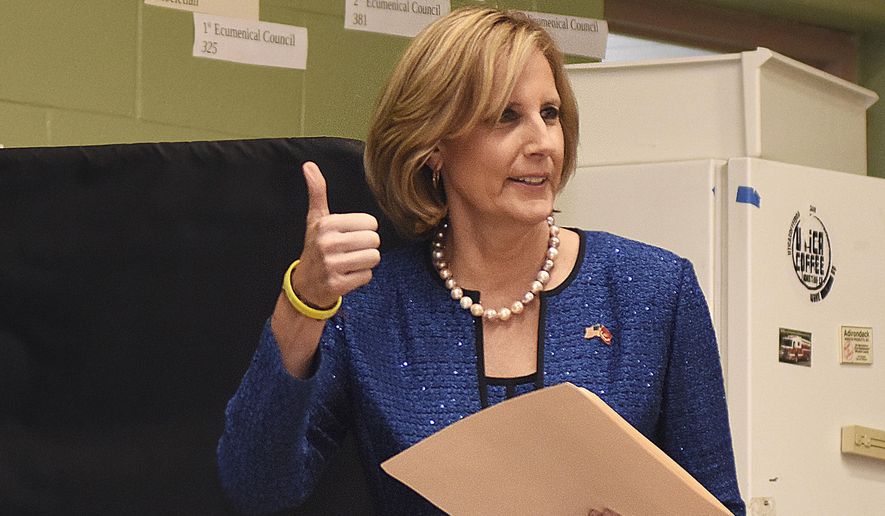 In this Nov. 6, 2018, file photo, Republican Congresswoman Claudia Tenney signals she successfully cast her ballot after voting at St. George&#x27;s Church in New Hartford, N.Y. On Tuesday, Dec. 1, 2020, Chenango County informed a state judge it had discovered 55 early voting ballots that weren&#x27;t canvassed by the local board of election, and therefore weren&#x27;t included in the vote totals in the ultra-tight race between Tenney and U.S. Rep. Anthony Brindisi.  The most recent results — which don’t include those ballots — showed Tenney with a 12-vote lead over Brindisi. (AP Photo/Heather Ainsworth, File)