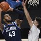 Villanova&#39;s Eric Dixon, left, shoots over Hartford&#39;s Hunter Marks in the first half of an NCAA college basketball game, Tuesday, Dec. 1, 2020, in Uncasville, Conn. (AP Photo/Jessica Hill)