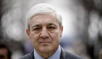 In this March 24, 2017, file photo, former Penn State President Graham Spanier walks from the Dauphin County Courthouse in Harrisburg, Pa. A federal appeals court on Tuesday, Dec. 1, 2020, reinstated Spanier&#39;s conviction for child endangerment over his handling of a report that former assistant football coach Jerry Sandusky had sexually abused a boy in a football team shower. (AP Photo/Matt Rourke, File)