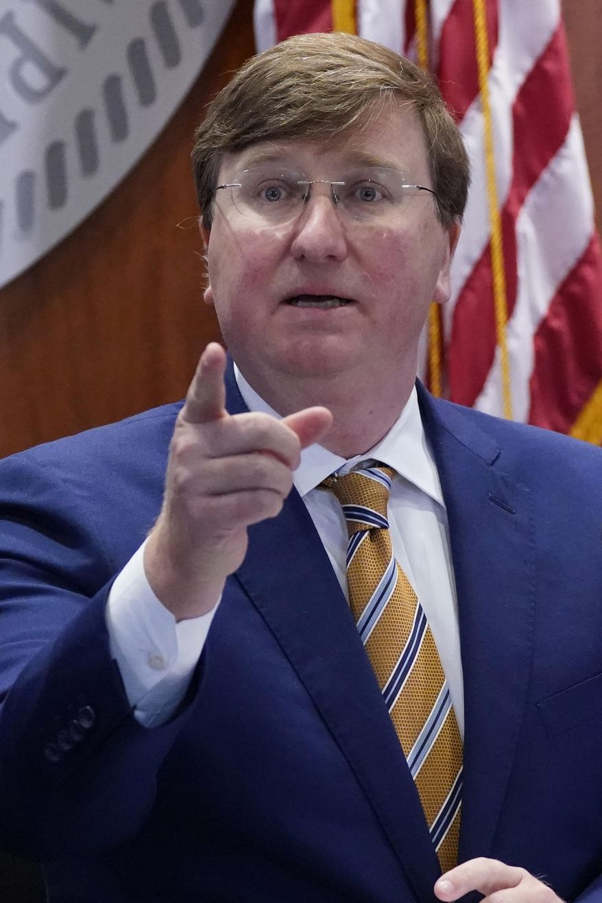 Mississippi Gov. Tate Reeves announces 13 additional counties that have qualified and met certain requirements to be placed under mask mandates with his "Safe Recovery" executive order that is in effect until Dec. 11 during his COVID news briefing, Tuesday, Dec. 1, 2020, in Jackson, Miss. (AP Photo/Rogelio V. Solis)