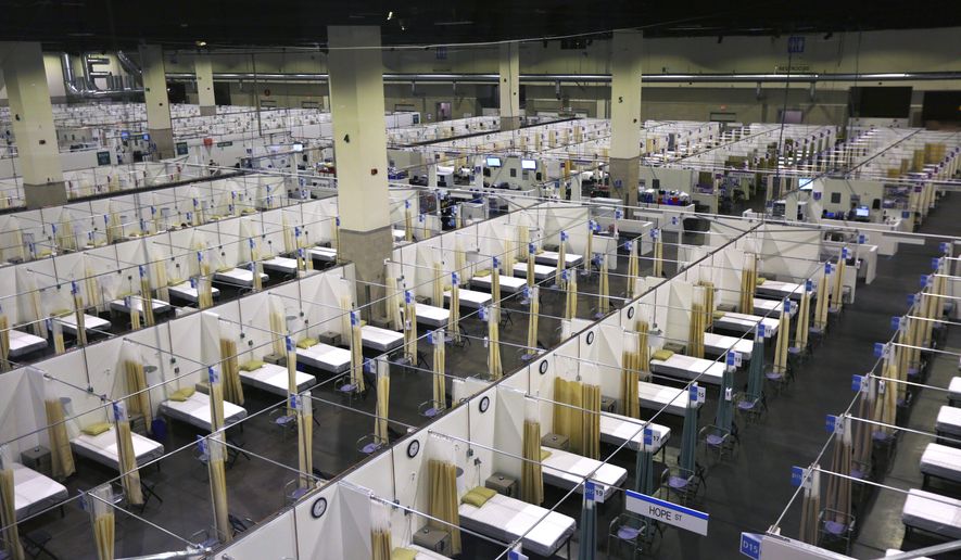 The Lifespan Alternative Hospital, which will soon be in operation, is set up at the Rhode Island Convention Center during the continuing coronavirus pandemic, in Providence, R.I. on Monday, Nov. 30, 2020. (Pat Greenhouse/The Boston Globe via AP)