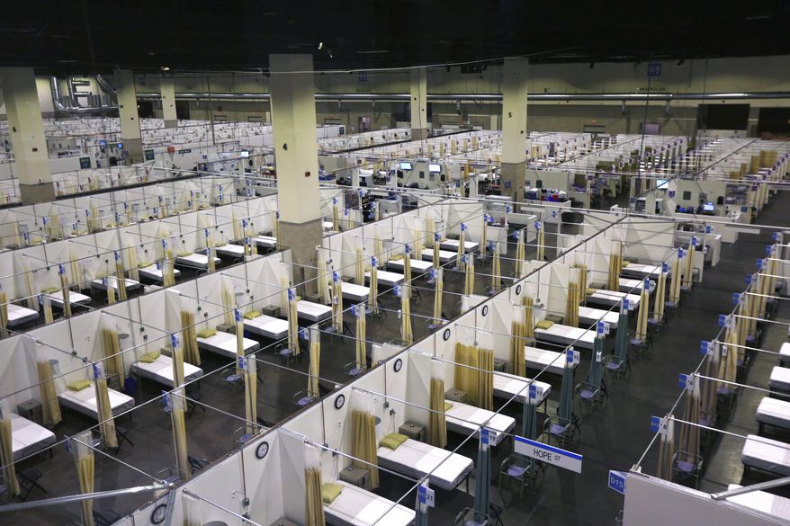 The Lifespan Alternative Hospital, which will soon be in operation, is set up at the Rhode Island Convention Center during the continuing coronavirus pandemic, in Providence, R.I. on Monday, Nov. 30, 2020. (Pat Greenhouse/The Boston Globe via AP)