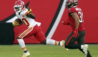 Kansas City Chiefs wide receiver Tyreek Hill (10) reacts as he beats Tampa Bay Buccaneers strong safety Antoine Winfield Jr. (31) on a 75-yard touchown reception during the first half of an NFL football game Sunday, Nov. 29, 2020, in Tampa, Fla. (AP Photo/Mark LoMoglio)