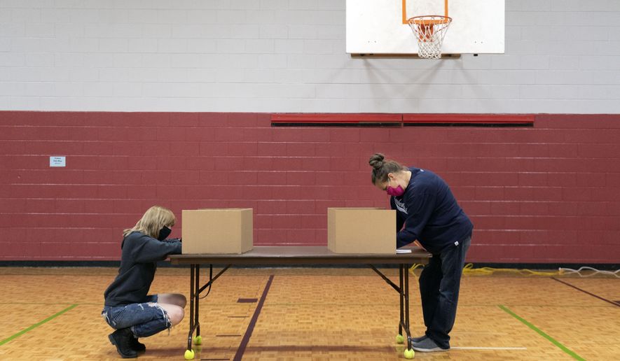 Voters mark their ballots during the presidential election in Knoxville, Tenn., on Tuesday, Nov. 3, 2020. (Saul Young/Knoxville News Sentinel via AP)