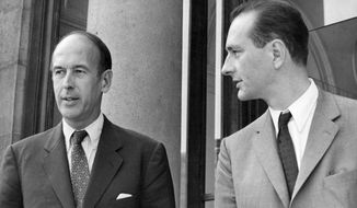 FILE - In this Aug.9 1969, Valery Giscard d&#x27;Estaing, left, as Finance Minister and Jacques Chirac as Secretary of State to Finance leave Elysee Palace, Aug. 9, 1969. Valery Giscard d’Estaing, the president of France from 1974 to 1981 who became a champion of European integration, has died Wednesday, Dec. 2, 2020 at the age of 94, his office and the French presidency said. (AP Photo, File)