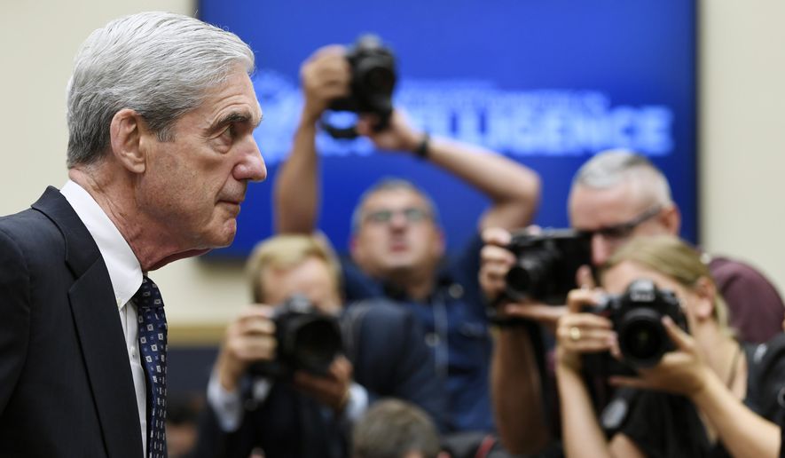 In this Wednesday, July 24, 2019, file photo, former special counsel Robert Mueller returns to the witness table following a break in his testimony before the House Intelligence Committee on Capitol Hill in Washington. NBC announced Wednesday, Dec. 2, 2020, that Mueller, the former special counsel who looked into Russian interference in the 2016 election, has given an extensive interview that debuts in early December. (AP Photo/Susan Walsh, File)