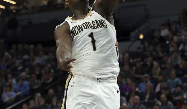FILE - New Orleans Pelicans&#x27; Zion Williamson dunks in the second half of an NBA basketball game against the Minnesota Timberwolves in Minneapolis, in this Sunday, March 8, 2020, file photo. Williamson expects to unleash a version of himself that is healthier, more demonstrative and less restrained in his second NBA season with the Pelicans. “Year 1 was a lot mentally and physically for me, but I needed that experience,” Williamson said Wednesday, Dec. 2, as the Pelicans underwent preparations for training camp.  (AP Photo/Stacy Bengs, File)