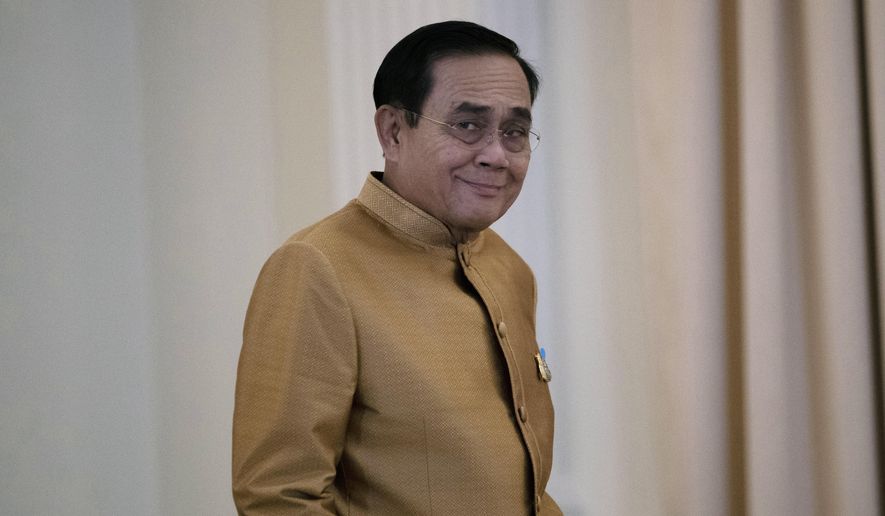 Thailand&#x27;s Prime Minister Prayuth Chan-ocha arrives to speak to the media during a press conference at Government House in Bangkok, Thailand, Tuesday, Dec. 1, 2020. (AP Photo/Sakchai Lalit)