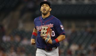 FILE - In this Sept. 24, 2019, file photo, Minnesota Twins left fielder Eddie Rosario jogs in during the baseball team&#39;s game against the Detroit Tigers in Detroit. The Twins declined Wednesday, Dec. 2, to offer a 2021 contract to Rosario, their regular left fielder for the last six seasons. (AP Photo/Paul Sancya, File)
