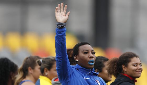 FILE - In this Aug. 10, 2019, file photo, Gwendolyn &amp;quot;Gwen&amp;quot; Berry of the United States waves as she is introduced at the start of the women&#39;s hammer throw final during athletics competition at the Pan American Games in Lima, Peru. Berry has won a humanitarian award for her outspoken role in raising social-justice issues in the United States. The 31-year-old hammer thrower wins the Toyota Humanitarian Award, given annually by USA Track and Field. She&#39;s being honored for her role in the debate about social inequality on and off the playing field for the past 16 months.  (AP Photo/Rebecca Blackwell, File)