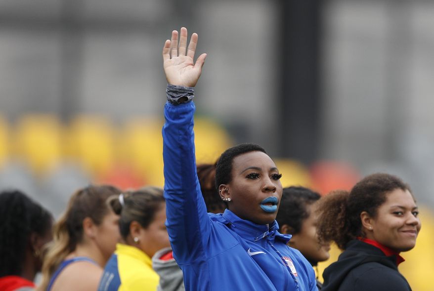 FILE - In this Aug. 10, 2019, file photo, Gwendolyn &amp;quot;Gwen&amp;quot; Berry of the United States waves as she is introduced at the start of the women&#39;s hammer throw final during athletics competition at the Pan American Games in Lima, Peru. Berry has won a humanitarian award for her outspoken role in raising social-justice issues in the United States. The 31-year-old hammer thrower wins the Toyota Humanitarian Award, given annually by USA Track and Field. She&#39;s being honored for her role in the debate about social inequality on and off the playing field for the past 16 months.  (AP Photo/Rebecca Blackwell, File)