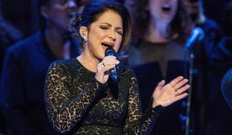 FILE - Gloria Estefan sings &amp;quot;Mas Alla&amp;quot; prior to Pope Francis celebrating Mass in New York on Sept. 25, 2015. Estefan said she&#39;s emerging from isolation after testing positive for COVID-19, days after dining outdoors at a Miami-area restaurant. Estefan says she fortunately only lost her sense of smell and taste and had “a little bit of a cough” and dehydration. In a video shared on Instagram, she says she&#39;s since tested negative.(Andrew Burton/Pool Photo via AP)