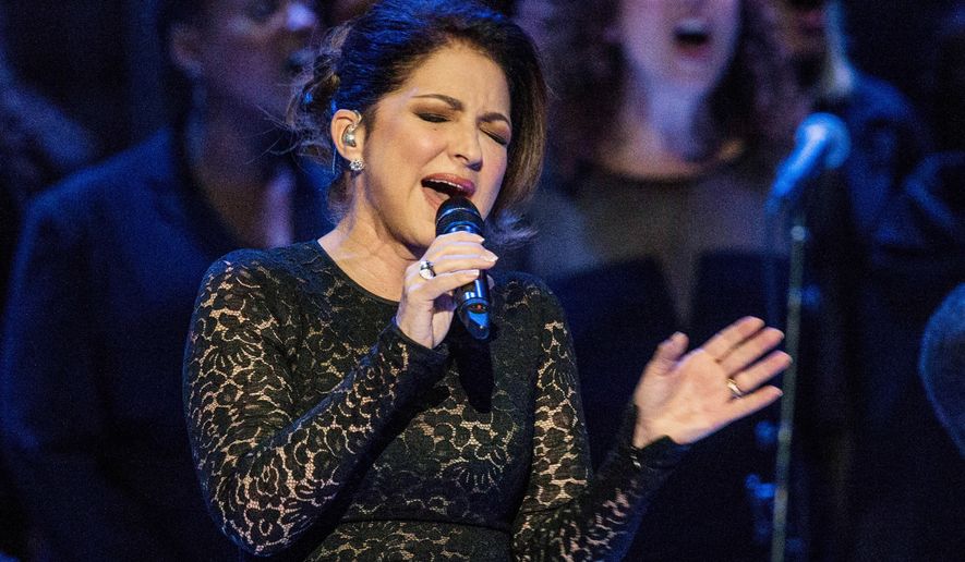 FILE - Gloria Estefan sings &amp;quot;Mas Alla&amp;quot; prior to Pope Francis celebrating Mass in New York on Sept. 25, 2015. Estefan said she&#x27;s emerging from isolation after testing positive for COVID-19, days after dining outdoors at a Miami-area restaurant. Estefan says she fortunately only lost her sense of smell and taste and had “a little bit of a cough” and dehydration. In a video shared on Instagram, she says she&#x27;s since tested negative.(Andrew Burton/Pool Photo via AP)
