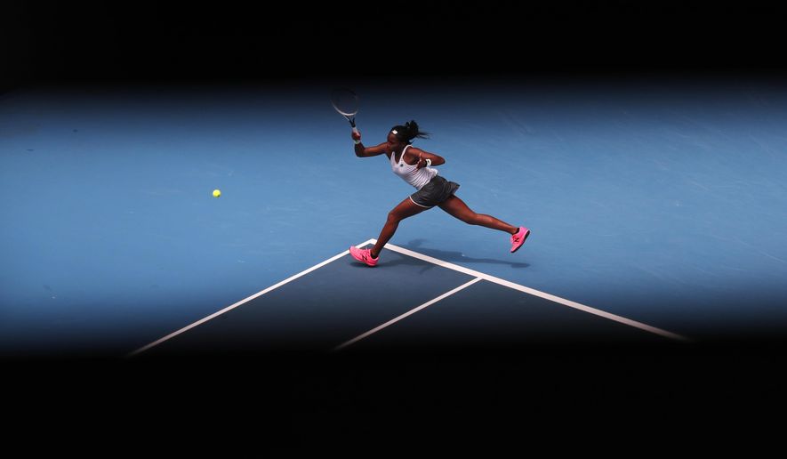 Cori &amp;quot;Coco&amp;quot; Gauff of the U.S. makes a forehand return to Romania&#x27;s Sorana Cirstea during their second round singles match at the Australian Open tennis championship in Melbourne, Australia, on Jan. 22, 2020. (AP Photo/Lee Jin-man)