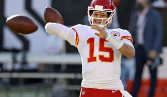 Kansas City Chiefs quarterback Patrick Mahomes (15) throws a pass before an NFL football game against the Tampa Bay Buccaneers Sunday, Nov. 29, 2020, in Tampa, Fla. (AP Photo/Mark LoMoglio)