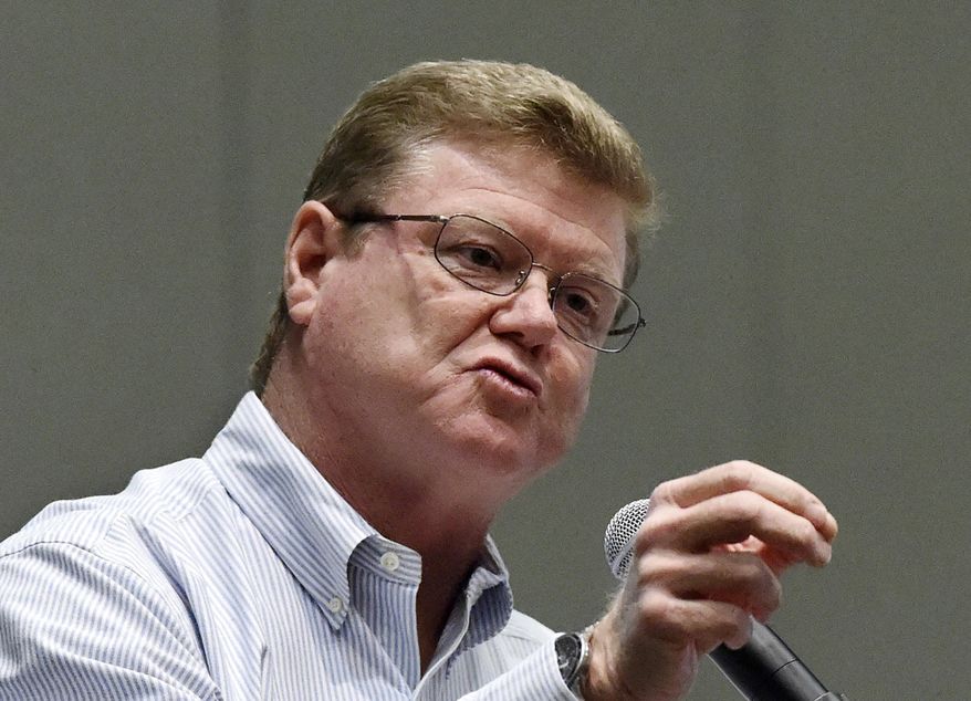 FILE - In this April 17, 2017, file photo, Nevada Republican U.S. Rep. Mark Amodei answers a question during a town hall at the Reno Sparks Convention Center in Reno, Nev. The veteran northern Nevada Republican congressman told a Las Vegas business audience that he is considering a run for governor in 2022. A month after winning his fifth term in Congress, Amodei said during a Vegas Chamber virtual event on Wednesday, Dec. 2, 2020 that members could expect to hear from him as he explores a possible gubernatorial run against Democratic Gov. Steve Sisolak, the Las Vegas Review-Journal reported. (Andy Barron/The Reno Gazette-Journal via AP, File)