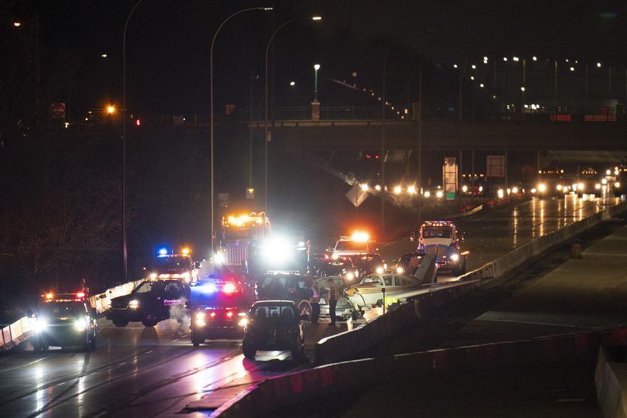 A single-engine plane is seen after making an emergency landing on northbound Interstate 35W, just north of County Road E2, in Arden Hills, Minn., late Wednesday, Dec. 2, 2020. (Jeff Wheeler/Star Tribune via AP)