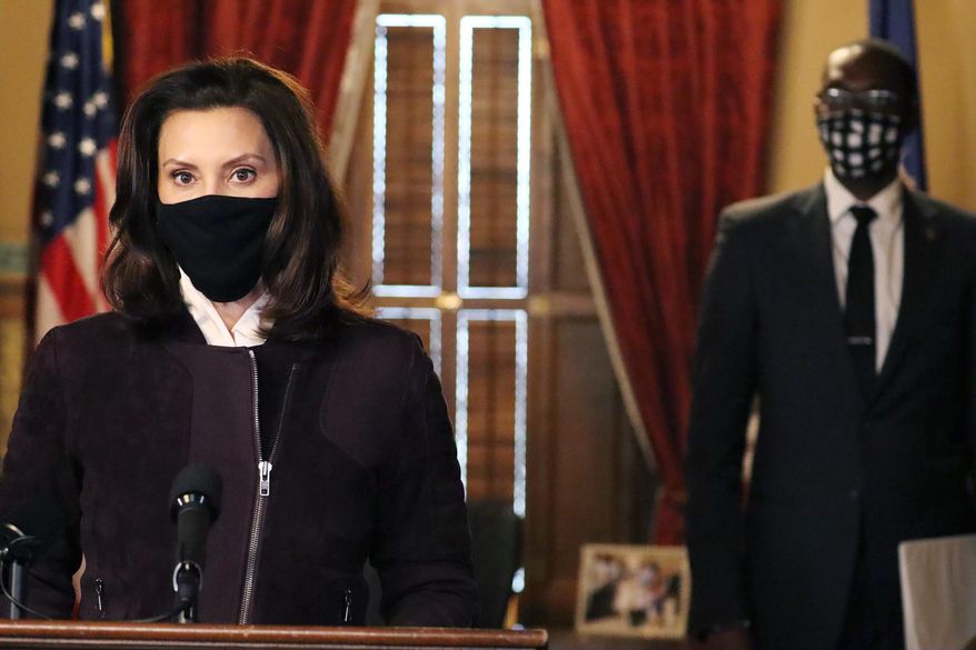In this photo provided by the Michigan Office of the Governor, Gov. Gretchen Whitmer addresses the state during a speech in Lansing, Mich., Thursday, Dec. 3, 2020. The governor said her administration may extend portions of a three-week partial shutdown of schools and businesses next week because of the "sheer volume" of coronavirus cases around Michigan. She said no decision had been made but added the while curve has leveled, it ultimately must come down to ensure hospitals are not overrun. (Michigan Office of the Governor via AP)