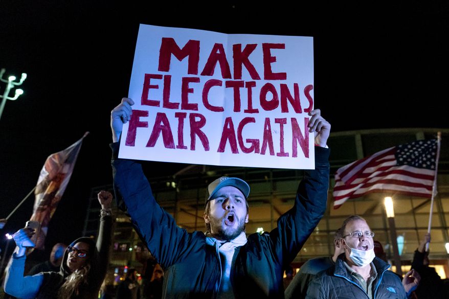 A supporter of President Donald Trump chants during a protest against the election results outside the central counting board at the TCF Center in Detroit, Nov. 5, 2020. (AP Photo/David Goldman) ** FILE ** 