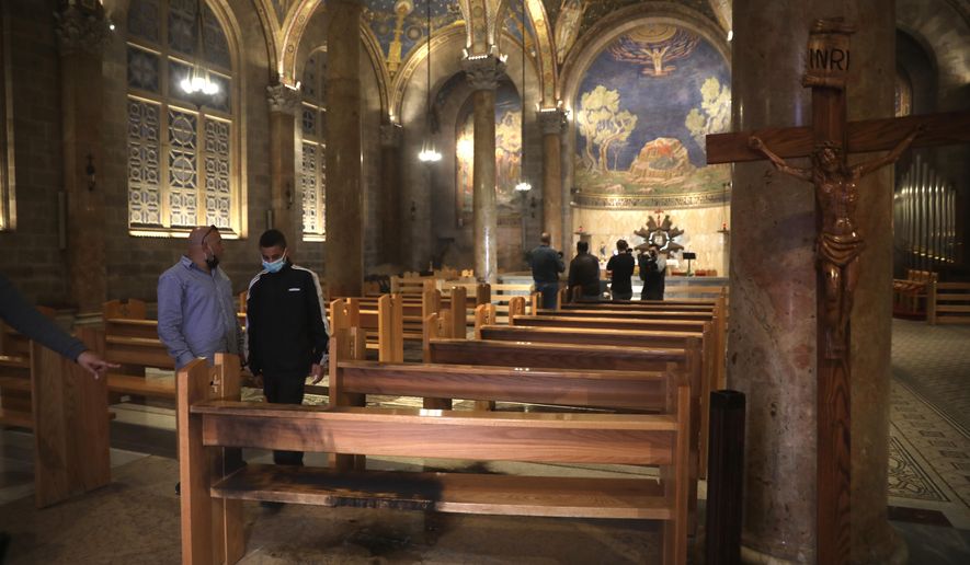 A burned pew is seen at the Church of All Nations in the Garden of Gethsemane, in east Jerusalem, Friday, Dec. 4, 2020. Israeli police said Friday they arrested a Jewish man after he poured out a &amp;quot;flammable liquid&amp;quot; inside a church near Jerusalem&#39;s Old City, in what they described as a &amp;quot;criminal&amp;quot; incident. (AP Photo/Mahmoud Illean)