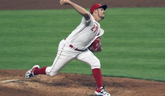 FILE - Cincinnati Reds&#39; Trevor Bauer throws in the third inning during a baseball game against the Chicago White Sox in Cincinnati, in this Saturday, Sept. 19, 2020, file photo. Bauer is a free agent. (AP Photo/Aaron Doster, File)