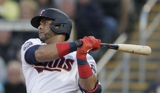 Minnesota Twins designated hitter Nelson Cruz (23) follows through on a single in the first inning of a spring training baseball game against the Pittsburgh Pirates in Fort Myers, Fla., in this Saturday, Feb. 29, 2020, file photo. Cruz is a free agent. (AP Photo/John Bazemore, File)
