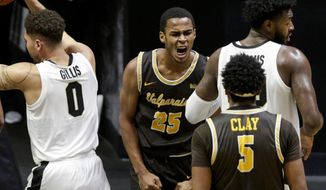 Valparaiso guard Nick Robinson (25) reacts after a basket during the first half of an NCAA college basketball game against Purdue, Friday, Dec. 4, 2020, in West Lafayette, Ind. (Nikos Frazier/Journal &amp;amp; Courier via AP)