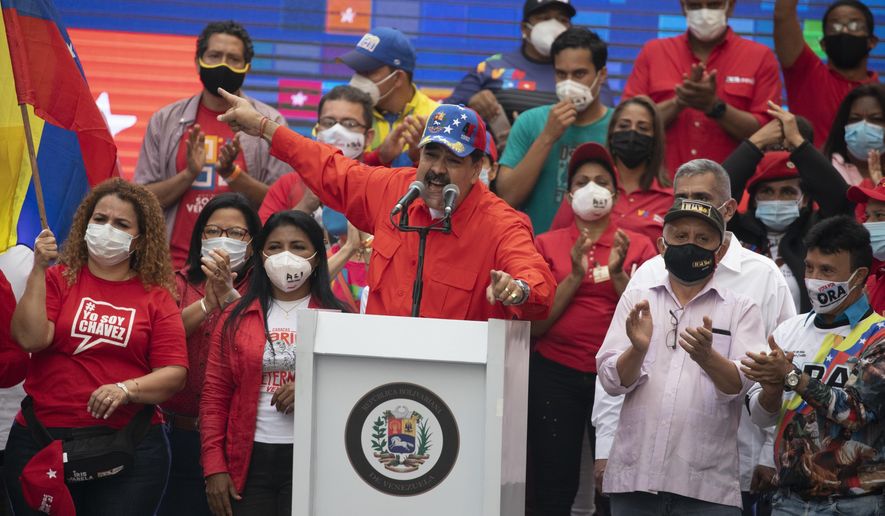 Venezuela&#39;s President Nicolas Maduro speaks to supporters during a closing campaign rally for the upcoming National Assembly elections in Caracas, Venezuela, Thursday, Dec. 3, 2020. Venezuelans will vote for a new National Assembly this Sunday, Dec 6. (AP Photo/Ariana Cubillos)
