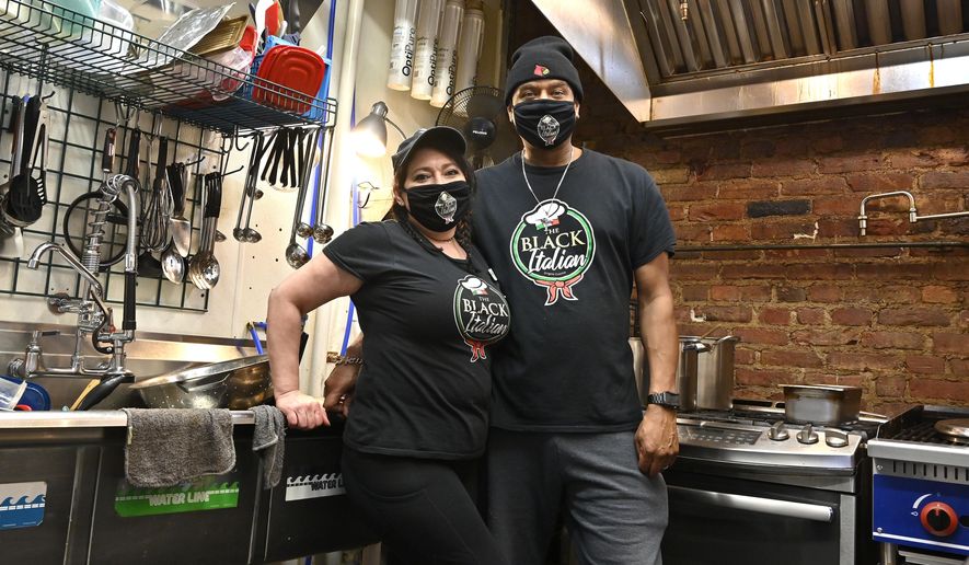 Owners of The Black Italian restaurant and catering service, Paula Hunter, left, and her husband Anthony Hunter in their empty restaurant in Louisville, Ky., Thursday, Dec. 3, 2020. The Hunter&#39;s spun off their catering service into a restaurant but now, hit with a recent statewide order closing restaurants to indoor dining until mid-December, the couple is hoping for another round of federal aid to hang on until vaccines can conquer the virus. (AP Photo/Timothy D. Easley)