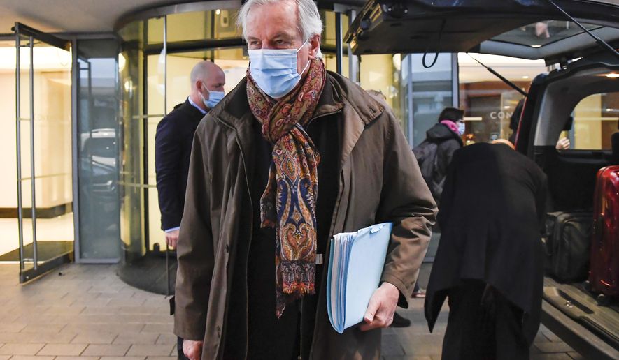 European Commission&#39;s chief negotiator Michel Barnier wears a face mask as he leaves his hotel to head back to Brussels, in London, Saturday, Dec. 5, 2020. With less than one month to go before the U.K. exits the EU&#39;s economic orbit, talks have been paused due to &amp;quot;significant divergences.&amp;quot; (AP Photo/Alberto Pezzali)