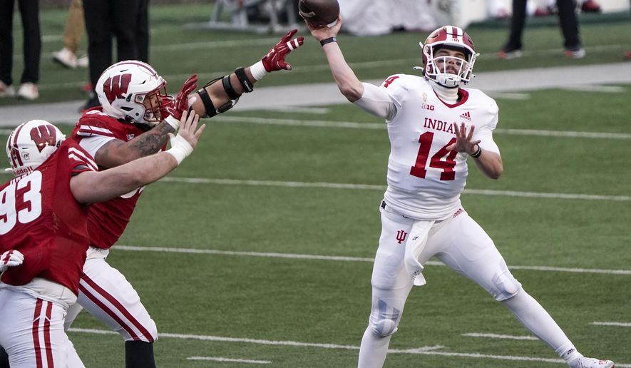 ndiana's Jack Tuttle throws a pass during the first half of an NCAA college football game against Wisconsin Saturday, Dec. 5, 2020, in Madison, Wis. (AP Photo/Morry Gash)