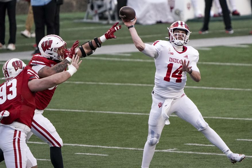 ndiana's Jack Tuttle throws a pass during the first half of an NCAA college football game against Wisconsin Saturday, Dec. 5, 2020, in Madison, Wis. (AP Photo/Morry Gash)
