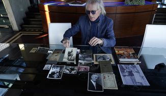 Jed Leiber shows photos of his grandfather Saemy Rosenberg&#x27;s life at home Thursday, Dec. 3, 2020, in Los Angeles. (AP Photo/Marcio Jose Sanchez)