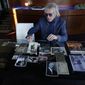 Jed Leiber shows photos of his grandfather Saemy Rosenberg&#39;s life at home Thursday, Dec. 3, 2020, in Los Angeles. (AP Photo/Marcio Jose Sanchez)
