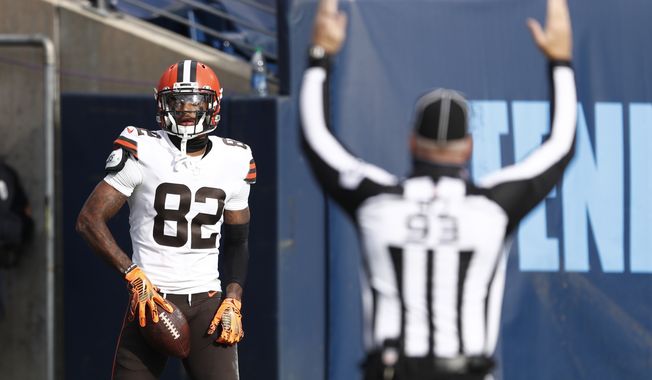 Cleveland Browns wide receiver Rashard Higgins (82) scores a touchdown against the Tennessee Titans in the first half of an NFL football game Sunday, Dec. 6, 2020, in Nashville, Tenn. (AP Photo/Wade Payne)