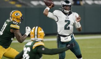 Philadelphia Eagles&#x27; Jalen Hurts throws during the second half of an NFL football game against the Green Bay Packers Sunday, Dec. 6, 2020, in Green Bay, Wis. (AP Photo/Morry Gash)