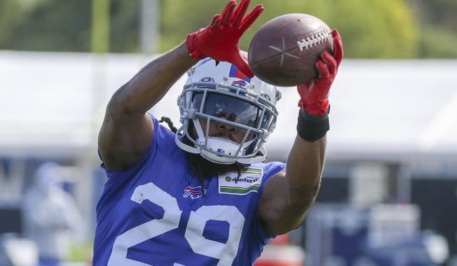 FILE - In this Aug. 18, 2020, file photo, Buffalo Bills cornerback Josh Norman (29) catches a pass during a fumble drill on the second day of training camp in Orchard Park, N.Y.  Norman has found peace in his ninth NFL season, and first with the Buffalo Bills. He&#x27;s put aside whatever lingering frustrations of being cast off by Washington last winter, and remained upbeat despite a missing six games with a nagging hamstring injury, and another after testing positive for COVID-19.  (James P. McCoy/Buffalo News via AP, Pool, File)