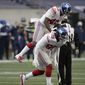 New York Giants defensive end Leonard Williams (99) celebrates with linebacker Tae Crowder (48) after Williams sacked Seattle Seahawks quarterback Russell Wilson (not shown) during the second half of an NFL football game, Sunday, Dec. 6, 2020, in Seattle. (AP Photo/Larry Maurer)