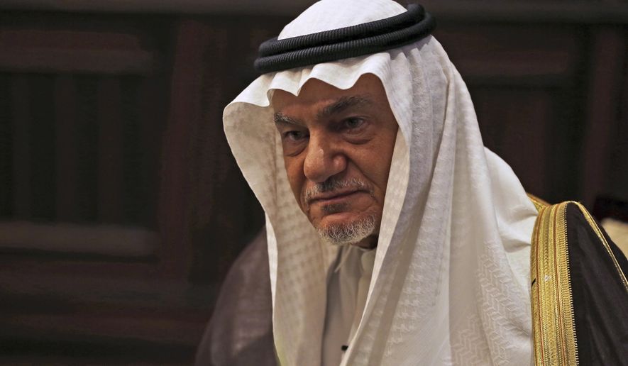 FILE - In this Nov. 24, 2018 file photo, Saudi Prince Turki al-Faisal talks to The Associated Press in Abu Dhabi, United Arab Emirates. Turki harshly criticized Israel on Sunday, Dec. 6, 2020, at a Bahrain security summit that was remotely attended by Israel's foreign minister. (AP Photo/Kamran Jebreili, File)