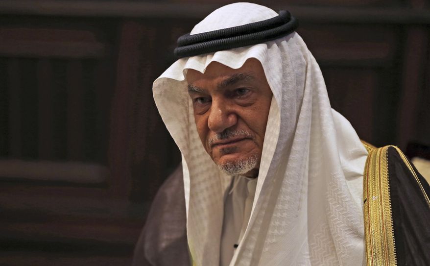 FILE - In this Nov. 24, 2018 file photo, Saudi Prince Turki al-Faisal talks to The Associated Press in Abu Dhabi, United Arab Emirates. Turki harshly criticized Israel on Sunday, Dec. 6, 2020, at a Bahrain security summit that was remotely attended by Israel's foreign minister. (AP Photo/Kamran Jebreili, File)