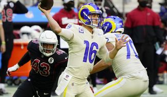 Los Angeles Rams quarterback Jared Goff (16) throws as Arizona Cardinals outside linebacker Haason Reddick (43) pursues during the first half of an NFL football game, Sunday, Dec. 6, 2020, in Glendale, Ariz. (AP Photo/Rick Scuteri)