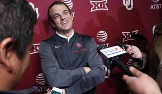 FILE - In this Jan. 26, 2018, file photo, Shane Beamer, an assistant football coach at Oklahoma, speaks during a news conference in Norman, Okla.  Beamer is returning to South Carolina, this time as head coach. A source close to the search told The Associated Press on Saturday night, Dec. 5, that Beamer will be hired and take over the program run the past five seasons by Will Muschamp. Muschamp was let go last month with three games remaining in the season. The person spoke to the AP on the condition of anonymity because South Carolina has not yet made the hire official. (Steve Sisney/The Oklahoman via AP, File)