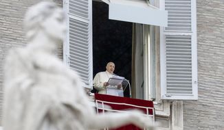 Pope Francis delivers his blessing as he recites the Angelus noon prayer from the window of his studio overlooking St.Peter&#39;s Square, at the Vatican, Sunday, Dec. 6, 2020. (AP Photo/Andrew Medichini)