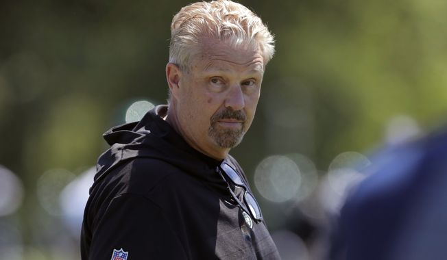 In this June 4, 2019, file photo, New York Jets defensive coordinator Gregg Williams looks on as his players run drills at the team&#x27;s NFL football training facility in Florham Park, N.J. A person with direct knowledge of the decision says the New York Jets fired defensive coordinator Gregg Williams a day after his stunning play call cost the team its first win of the season. The still-winless Jets were seconds away from their first victory Sunday, Dec. 6, 2020, until Williams inexplicably called for an all-out blitz against Las Vegas. (AP Photo/Julio Cortez, File)  **FILE**