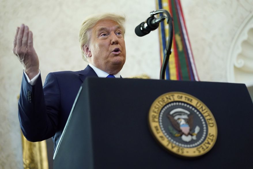 President Donald Trump speaks before awarding the Presidential Medal of Freedom, the highest civilian honor, to Olympic gold medalist and former University of Iowa wrestling coach Dan Gable in the Oval Office of the White House, Monday, Dec. 7, 2020, in Washington. (AP Photo/Patrick Semansky) ** FILE **