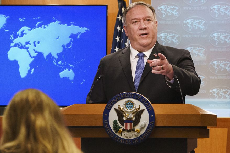 In this Nov. 10, 2020, file photo, Secretary of State Mike Pompeo gestures toward a reporter while speaking at the State Department in Washington. (AP Photo/Jacquelyn Martin, Pool) ** FILE **