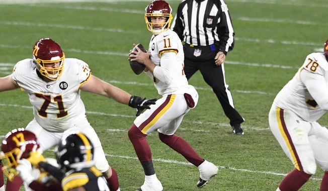 Washington Football Team quarterback Alex Smith (11) looks to pass during the second half of an NFL football game against the Pittsburgh Steelers in Pittsburgh, Monday, Dec. 7, 2020. (AP Photo/Barry Reeger)